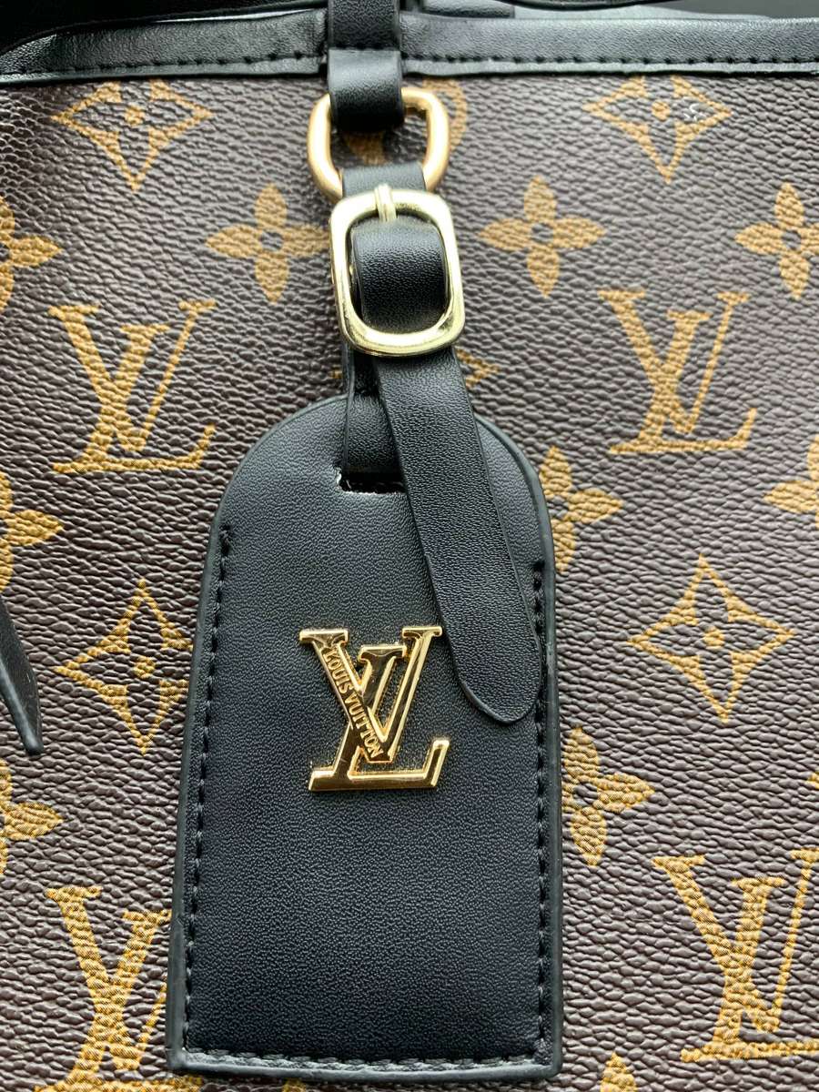 Designer Handbag in Monogram Canvas with black leather trim