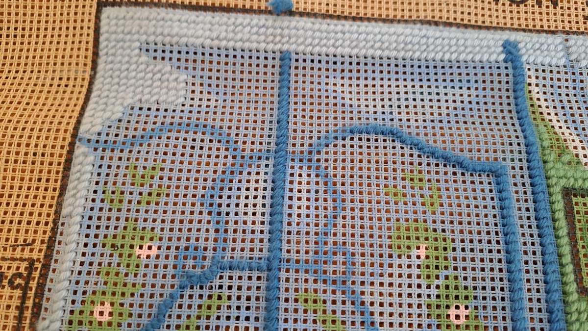 Tapestry canvas and a few yarns - partially completed- 30 x 40cm