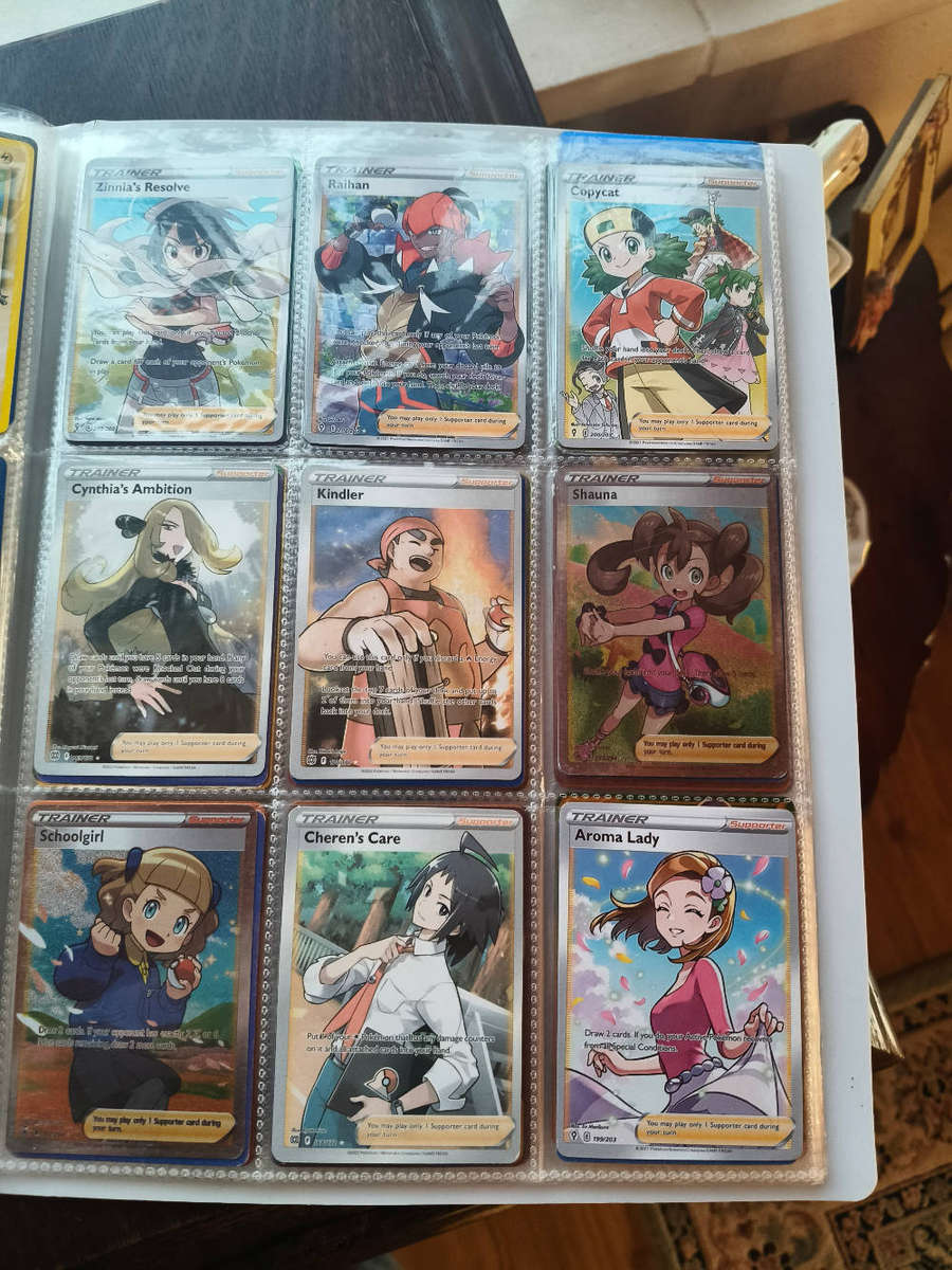 Lot of ±700 Pokémon Cards + 2 Pokémon Tins + Folder