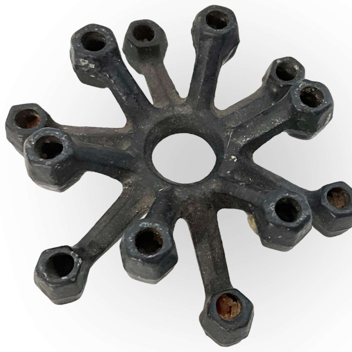 Three different styles of lighting- brass candlestick, Danish candleholder, modern floral tea light