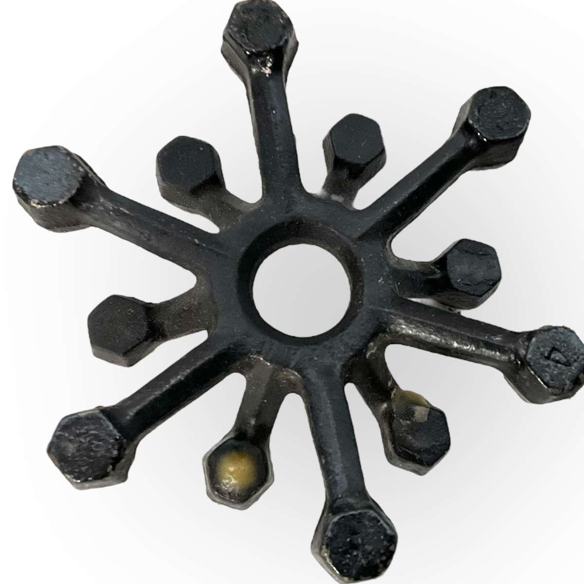 Three different styles of lighting- brass candlestick, Danish candleholder, modern floral tea light