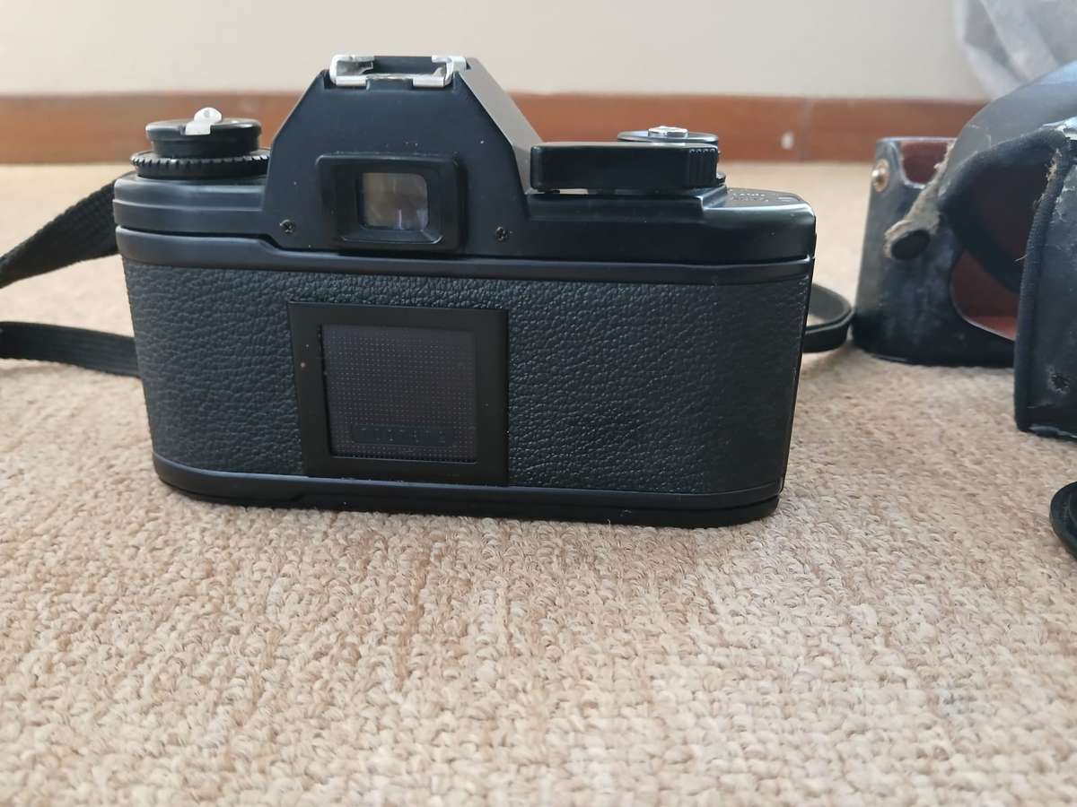 Nikon EM SLR 35mm Film Camera With 50mm Zoom Lens