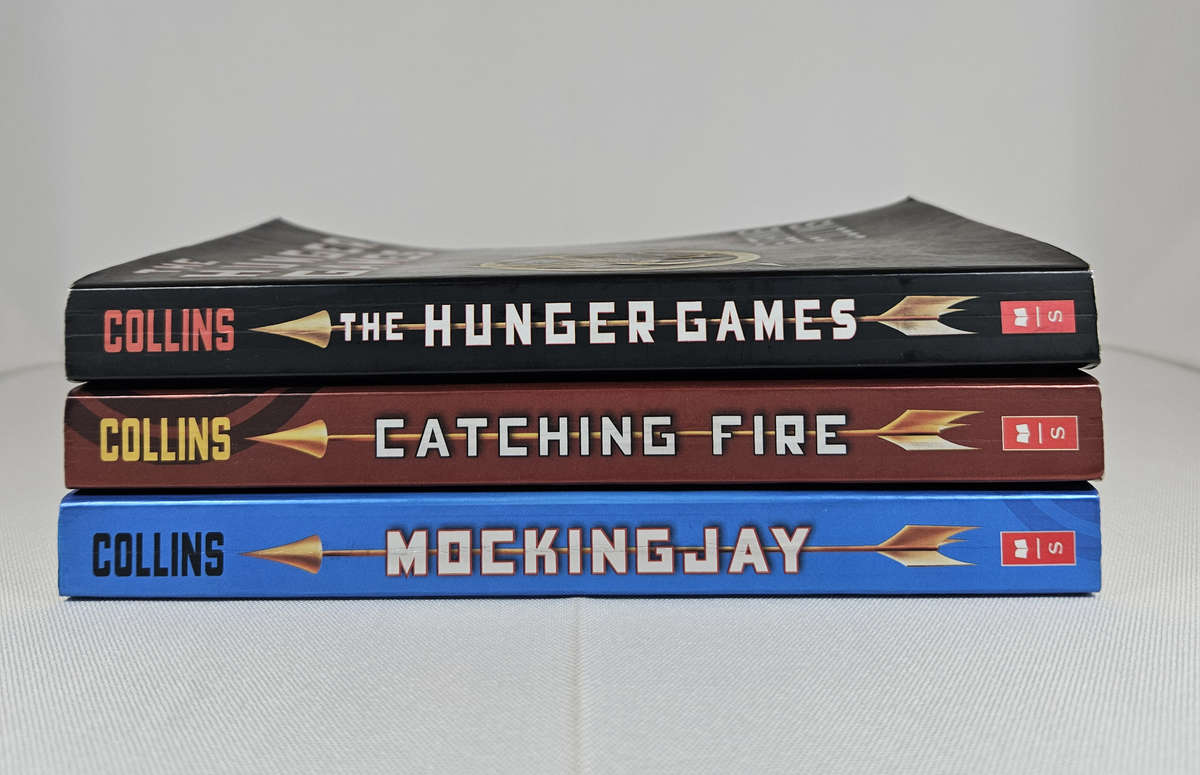 The Hunger Games Trilogy (Hunger Games, Catching Fire & Mockingjay) by Suzanne Collins - Paperback