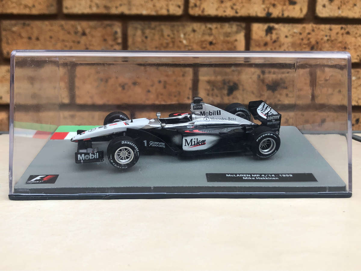 McLaren MP 4/14, 1999 (#1, Mika Hakkinen) model + magazine