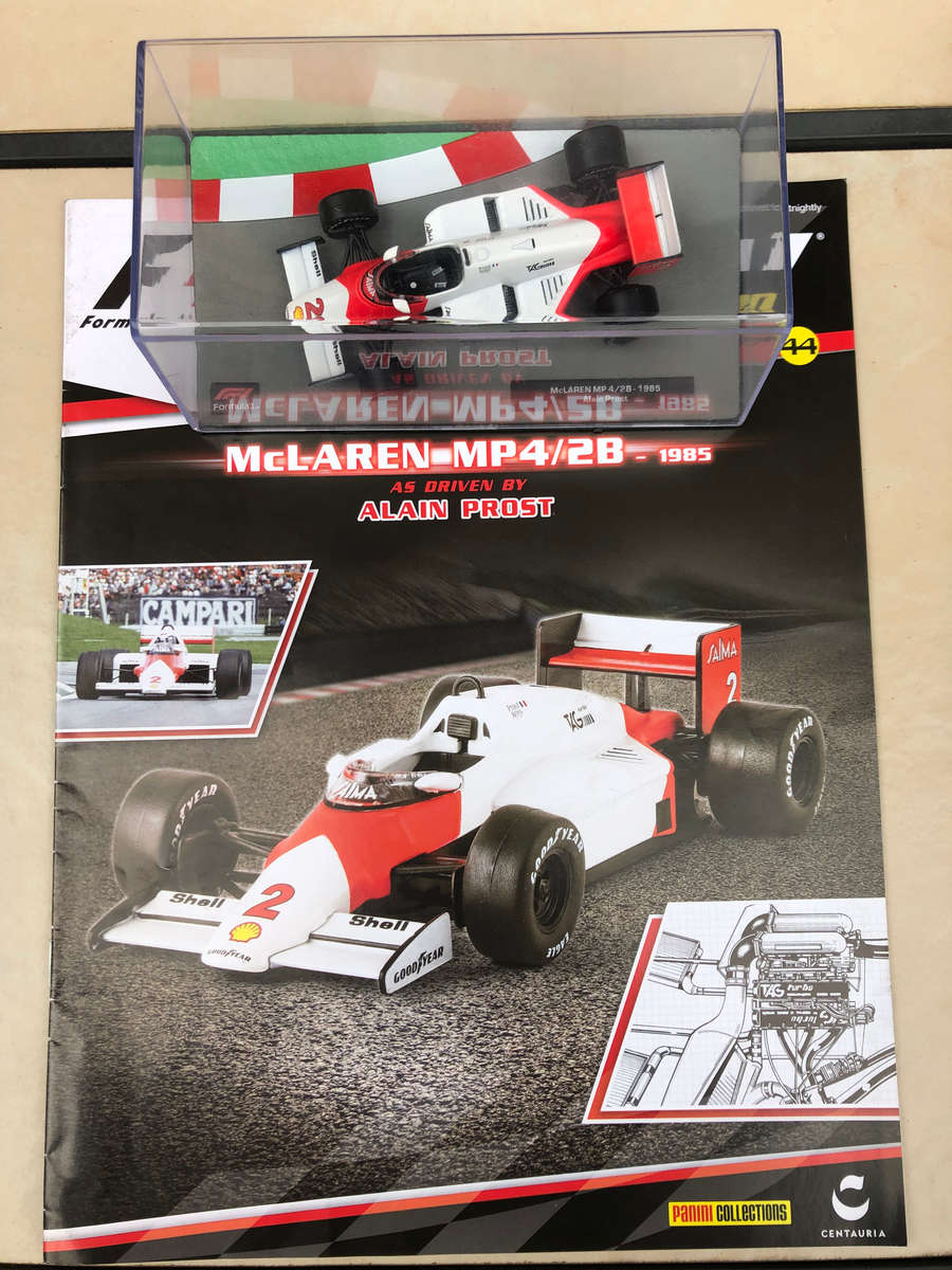 McLaren MP 4/2B, 1985 (#2, Alain Prost) + magazine