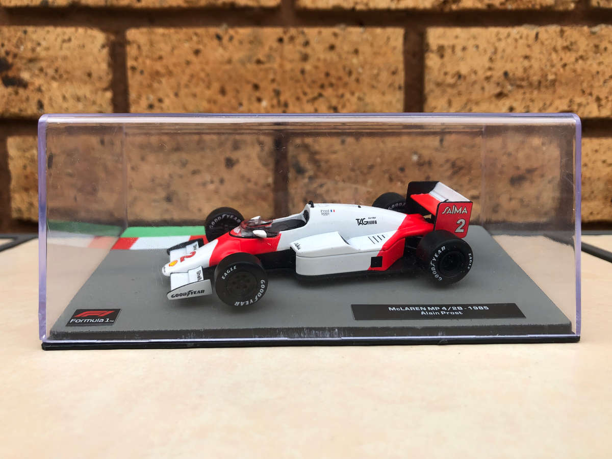 McLaren MP 4/2B, 1985 (#2, Alain Prost) + magazine