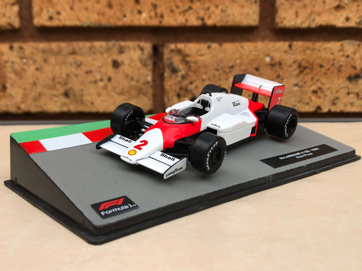 McLaren MP 4/2B, 1985 (#2, Alain Prost) + magazine