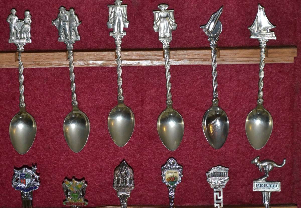 Collection of  Vintage Souvenir / Collectable Spoons in Display Case