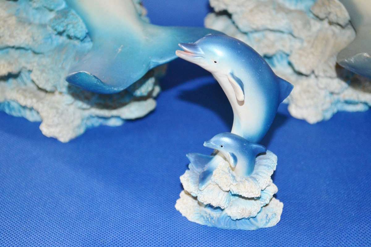 Pair of Large Bottle Nose Dolphins Plus Miniature