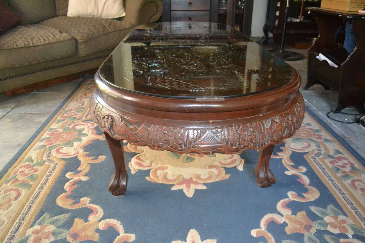 Chinese Oval Coffee Table with Carved Battle Scene