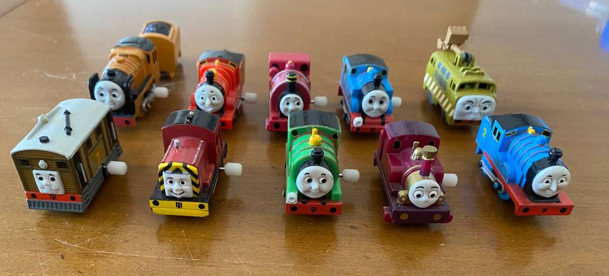 Miniature wind up and wooden Thomas and Friends trains with Thomas inspired storage containers