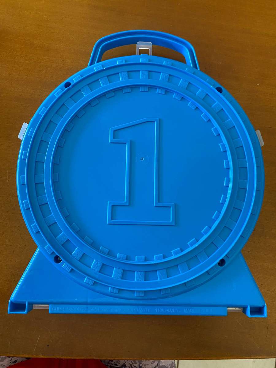 Miniature wind up and wooden Thomas and Friends trains with Thomas inspired storage containers