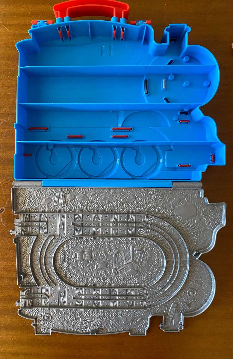 Miniature wind up and wooden Thomas and Friends trains with Thomas inspired storage containers