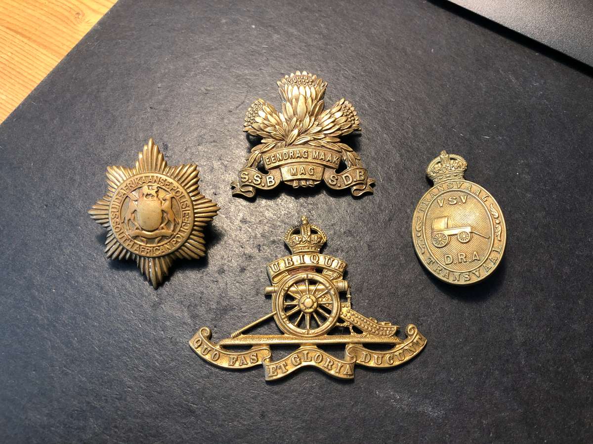 Lot of 4 Military type South African bronze badges - As per photo