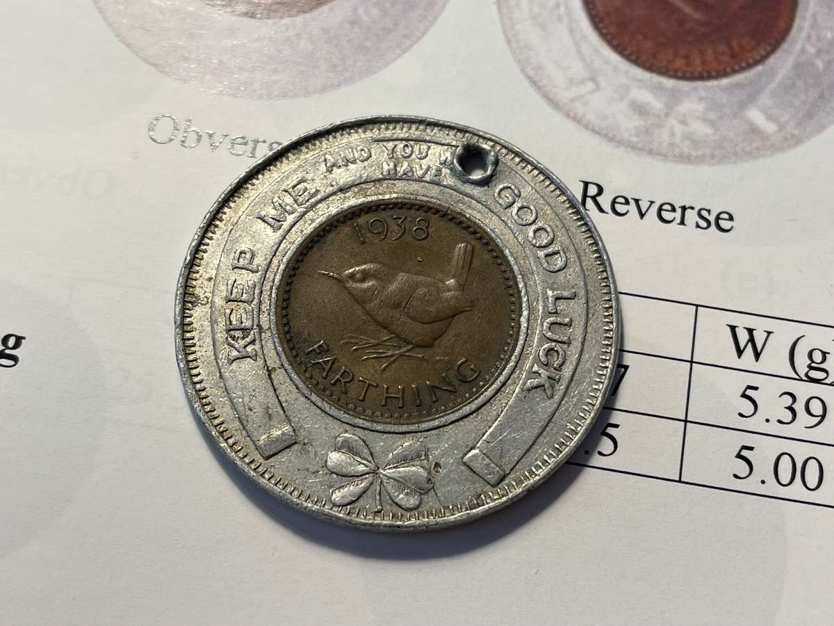 Scarce Cape Town good-luck token issued by a watch shop - Aluminium encased British farthing of 1938