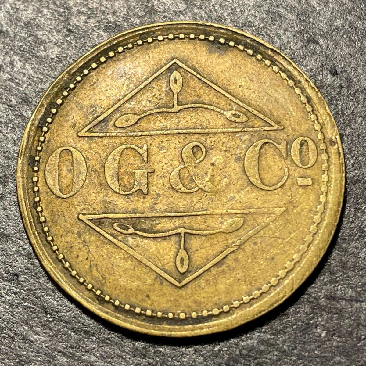 1920s OG & Co South African one and a half shilling brass token - Good condition