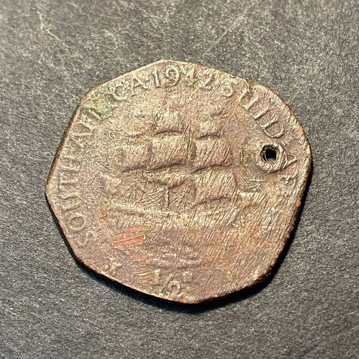 Strangely shaped 1942 bronze half penny coin - As per photo