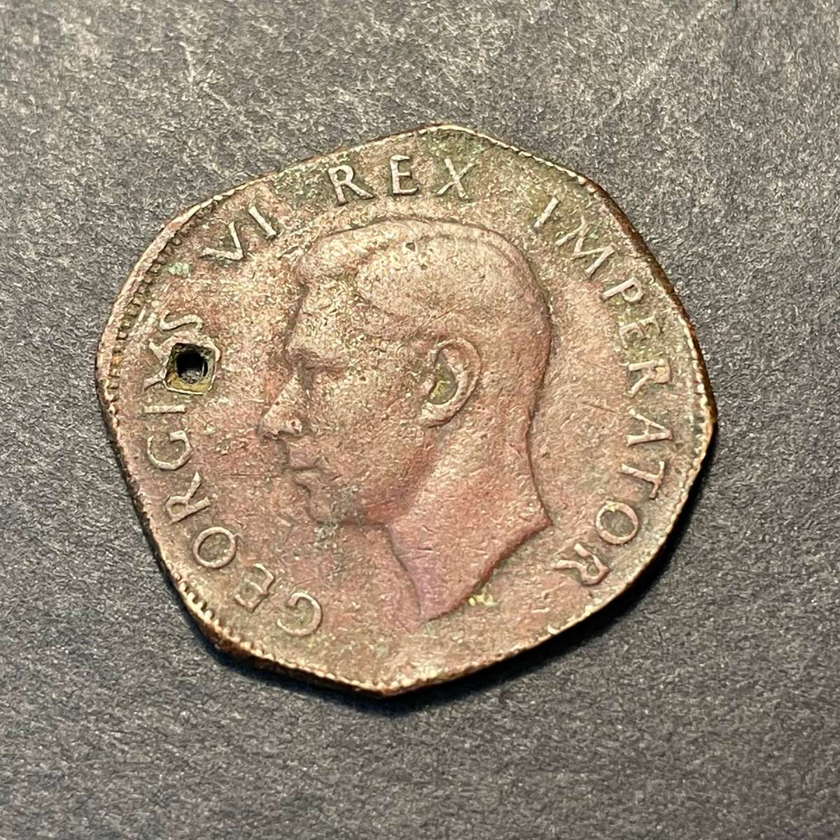 Strangely shaped 1942 bronze half penny coin - As per photo