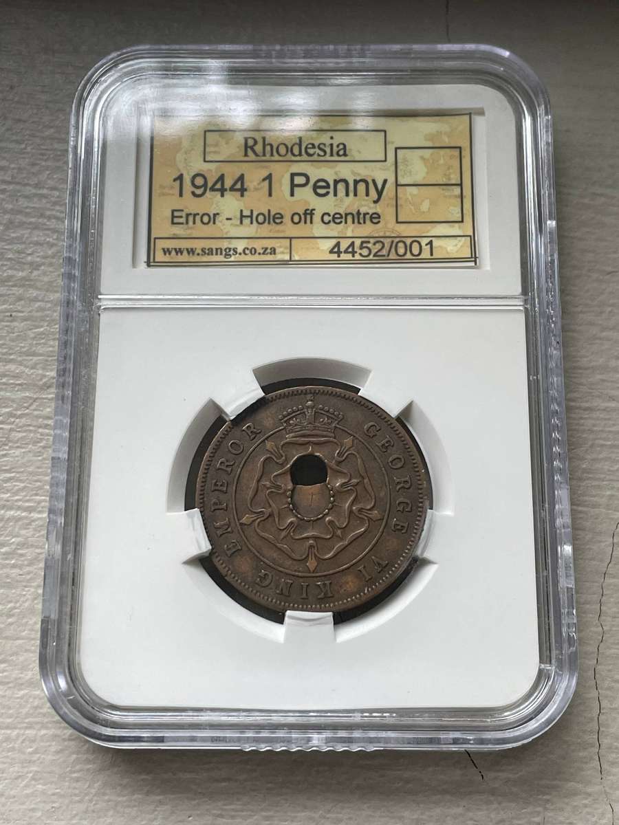 Mint error - Rare 1944 Rhodesian 1 penny coin with an off-centre punch - SANGS graded