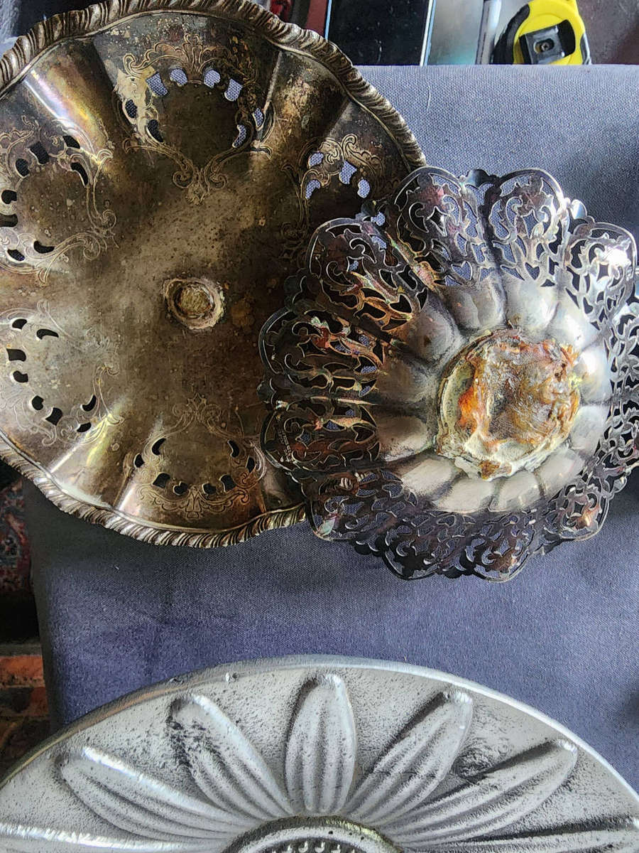 Collection of vintage or antique pewter and silver-plated tableware items.