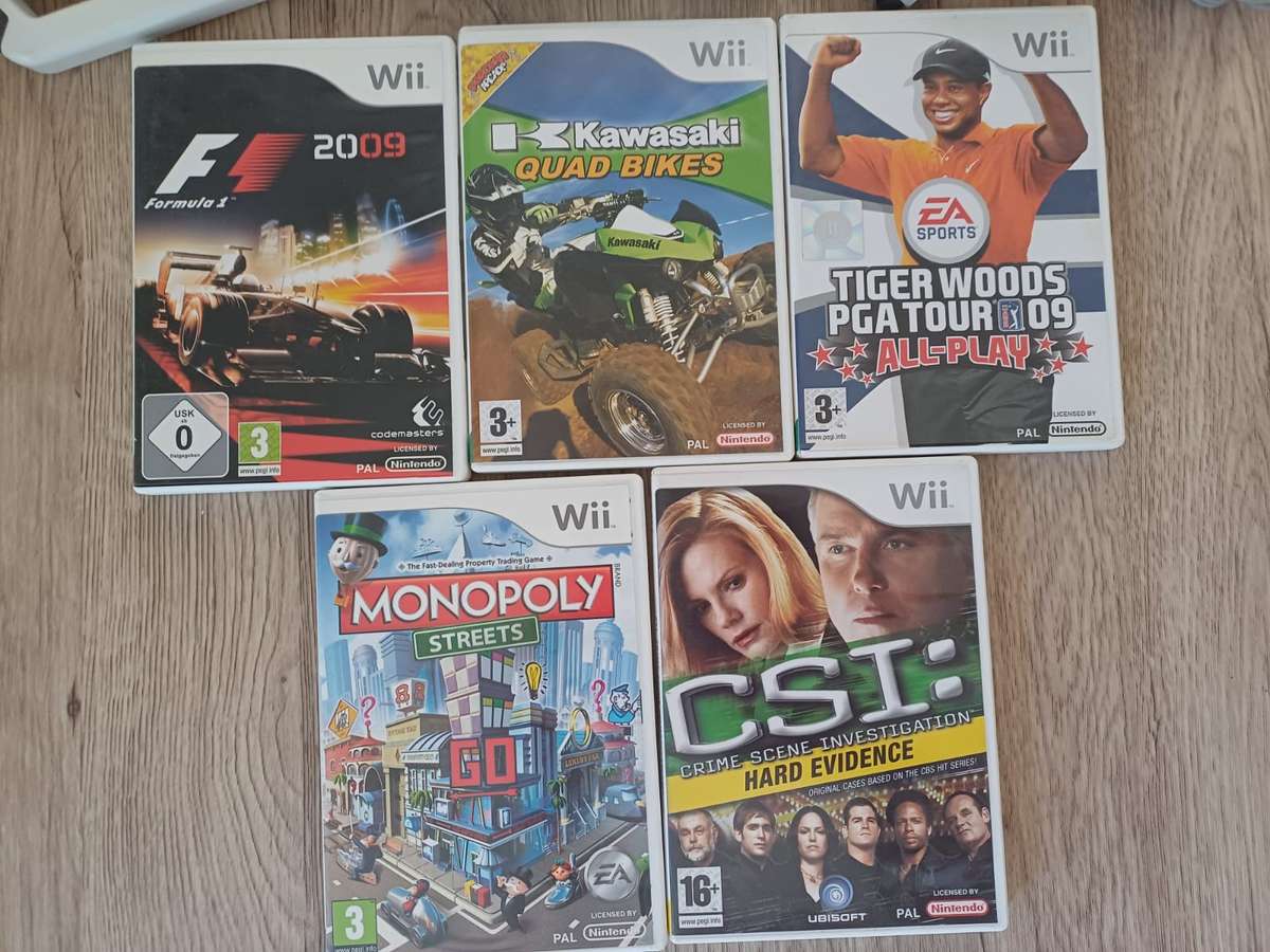 Wii complete system with 5 games + F1 steering wheel