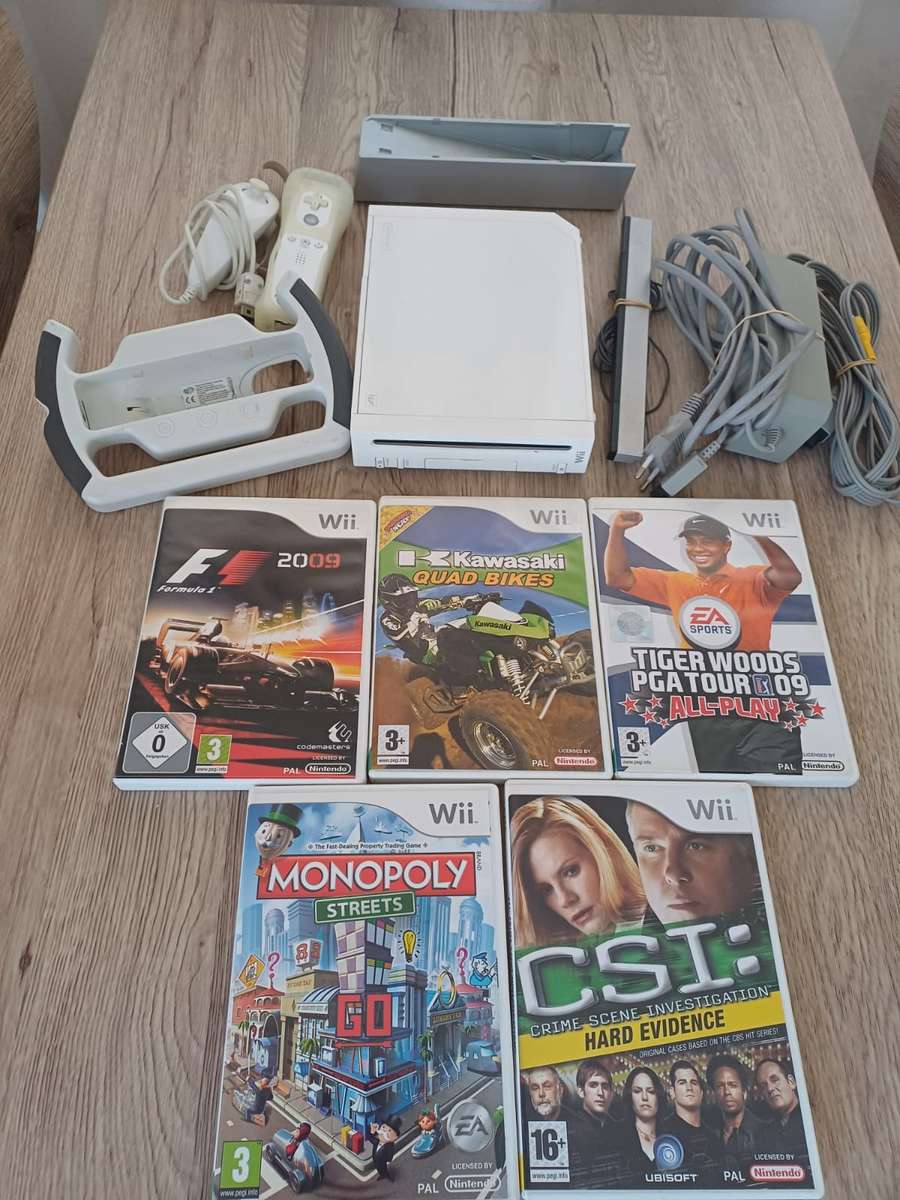 Wii complete system with 5 games + F1 steering wheel