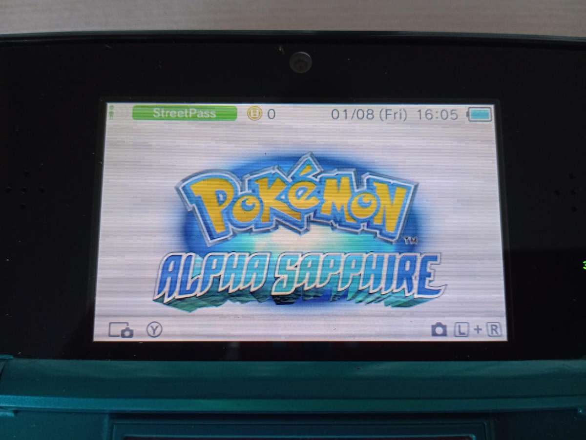 Nintendo 3ds console with original charger and memory card / stylus