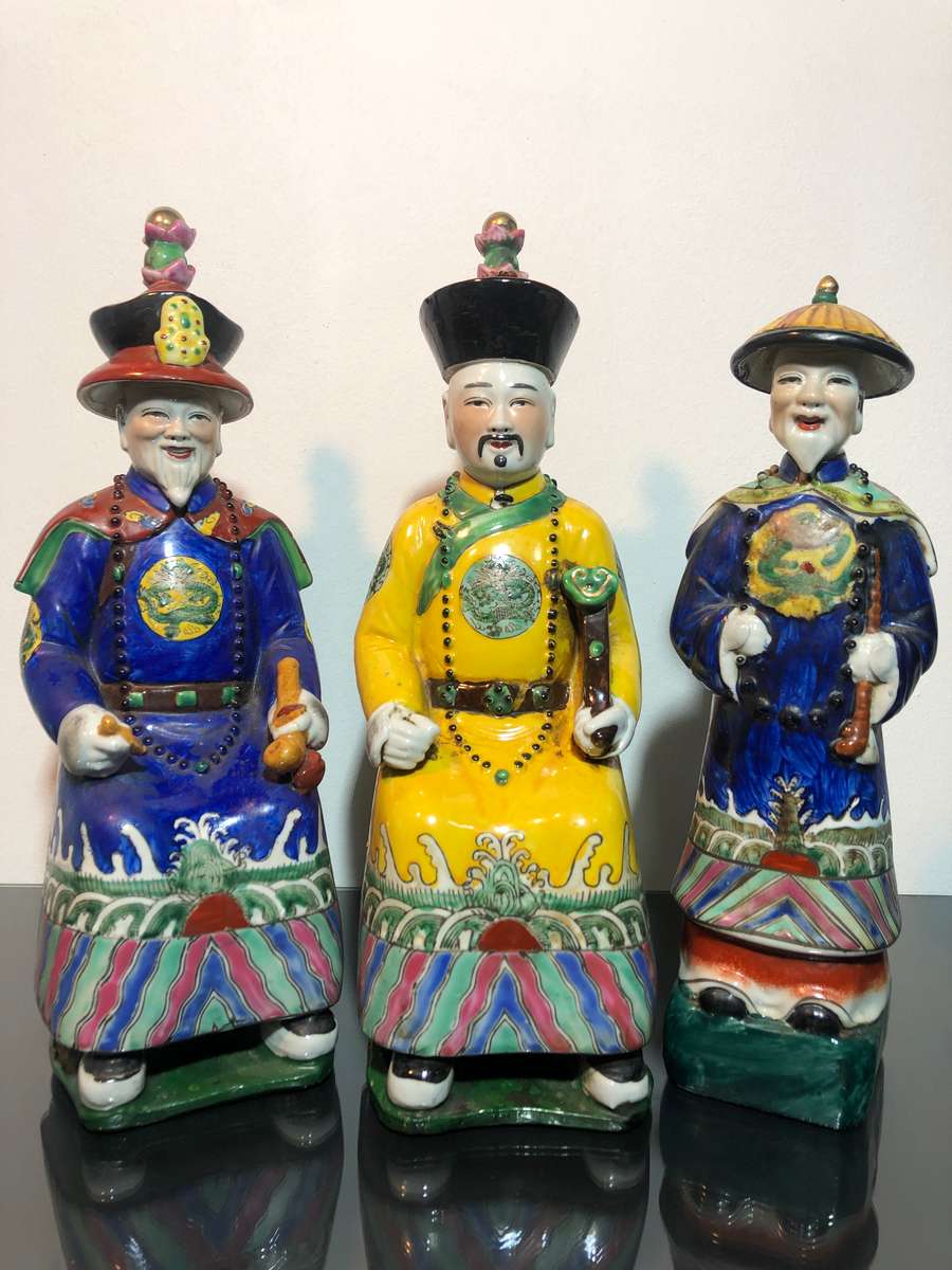 A Trio of Chinese Emperor Porcelain Statues