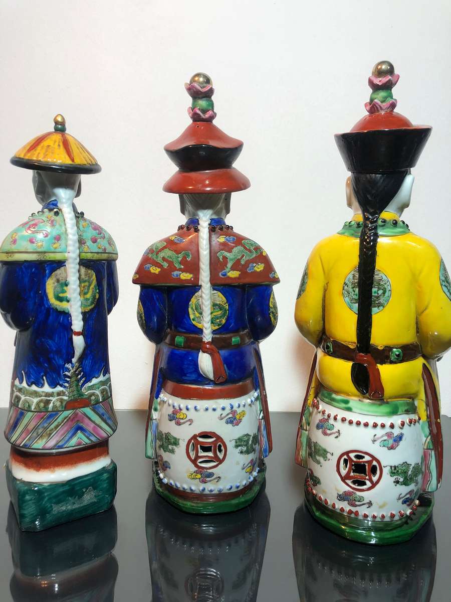 A Trio of Chinese Emperor Porcelain Statues