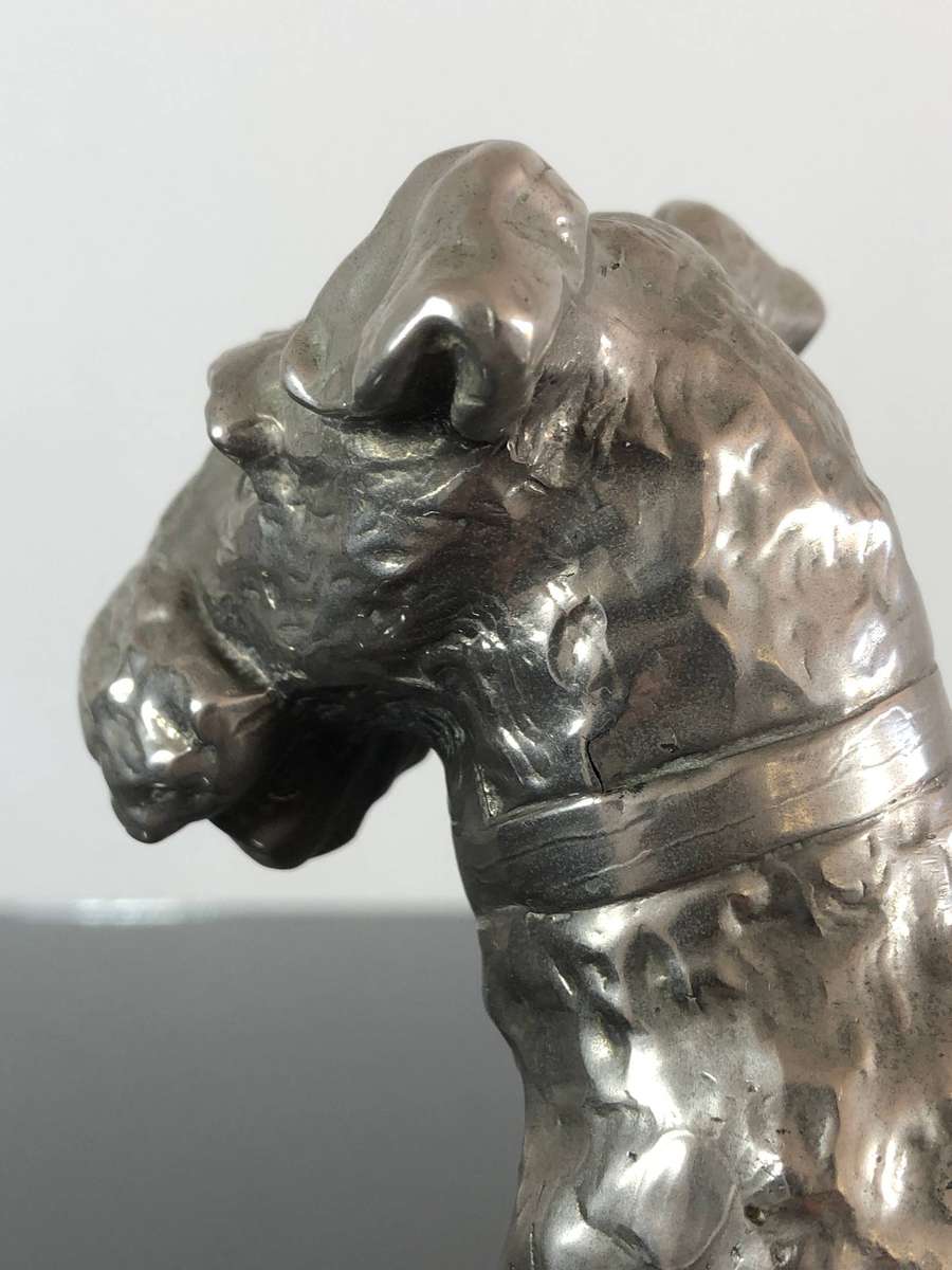 A Detailed Cast Sculpture Of A Wired Hair Fox Terrier On Stand