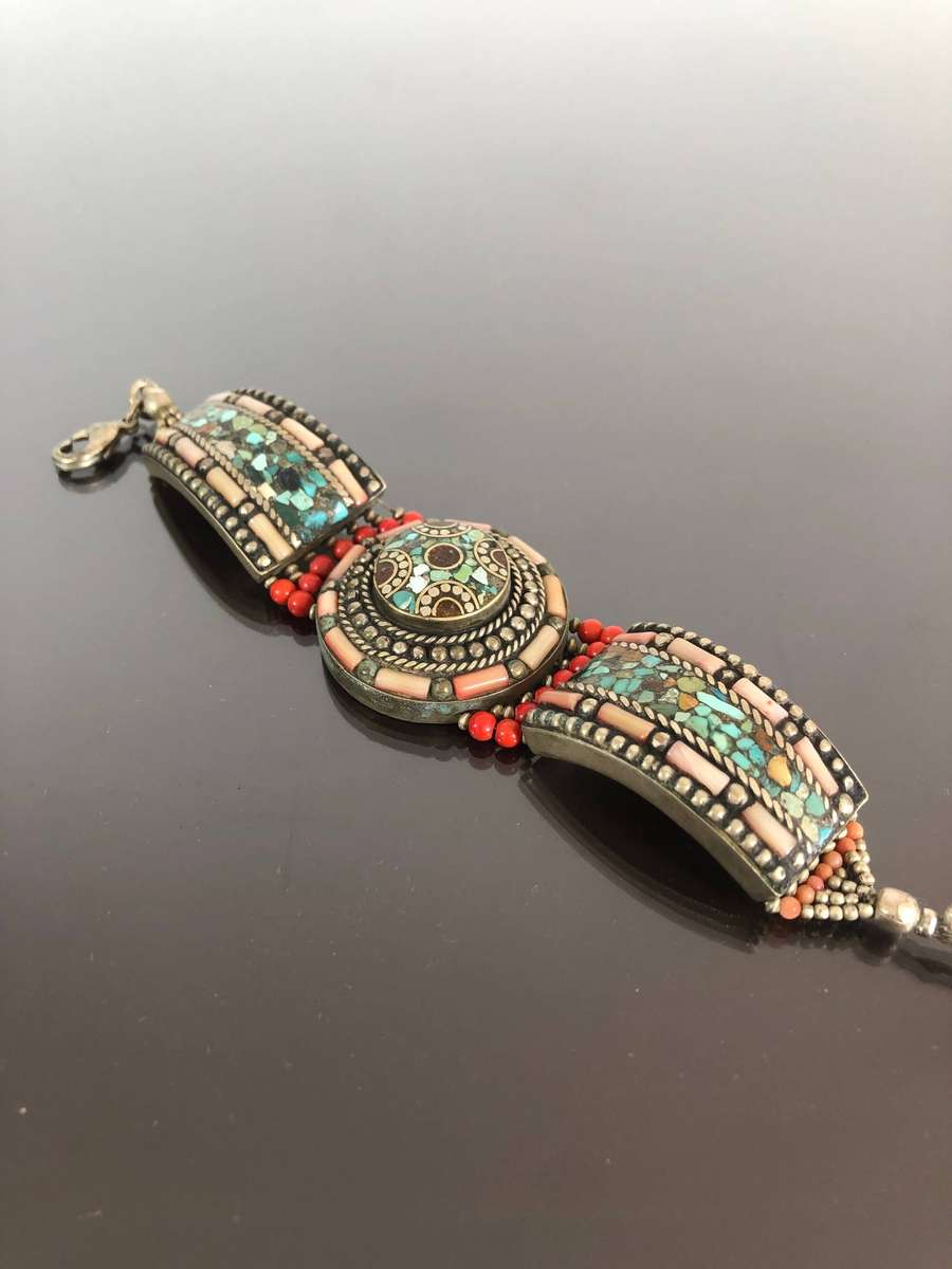 A Tibetan Silver Bracelet with intricate Turquoise and Red Coral Inlay