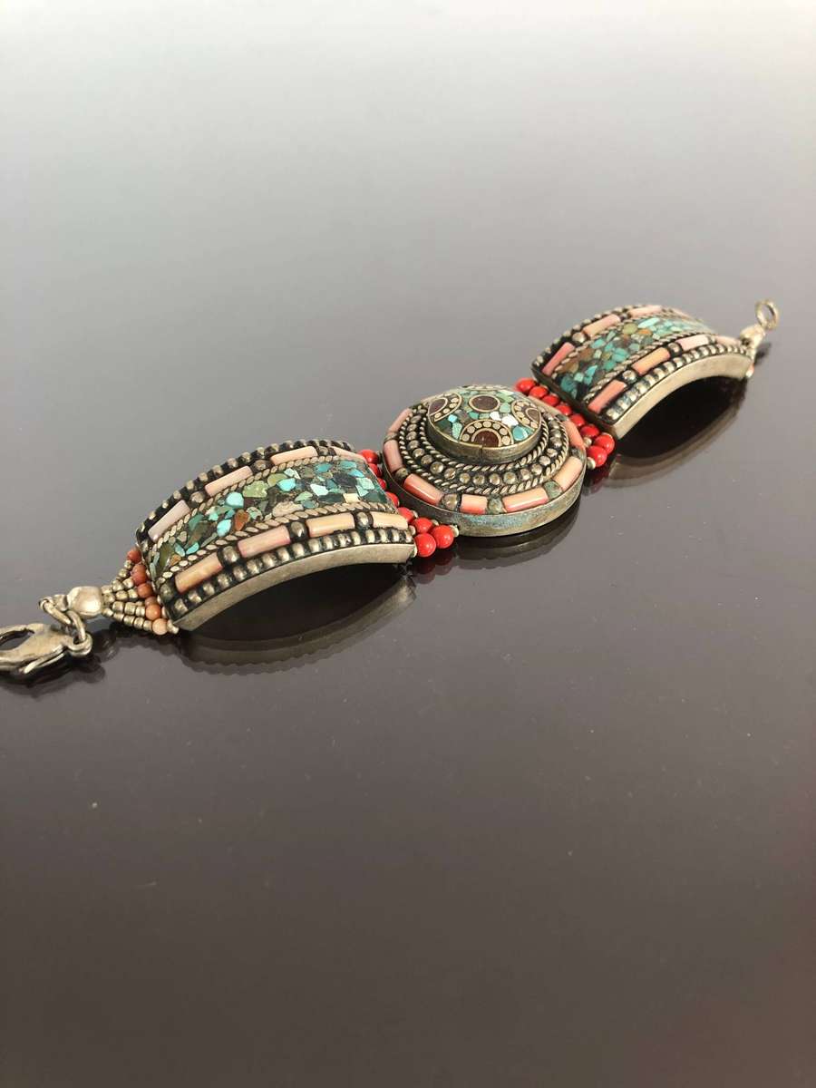 A Tibetan Silver Bracelet with intricate Turquoise and Red Coral Inlay