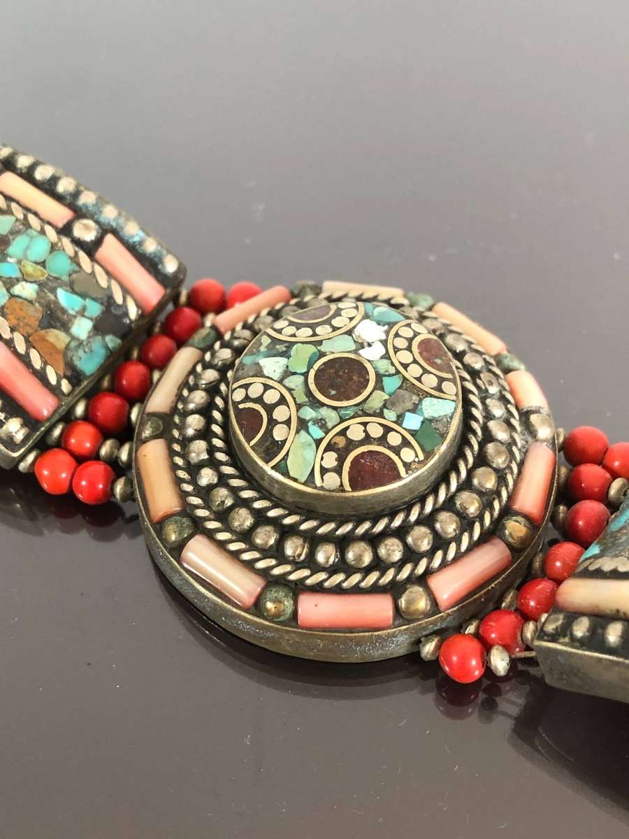 A Tibetan Silver Bracelet with intricate Turquoise and Red Coral Inlay