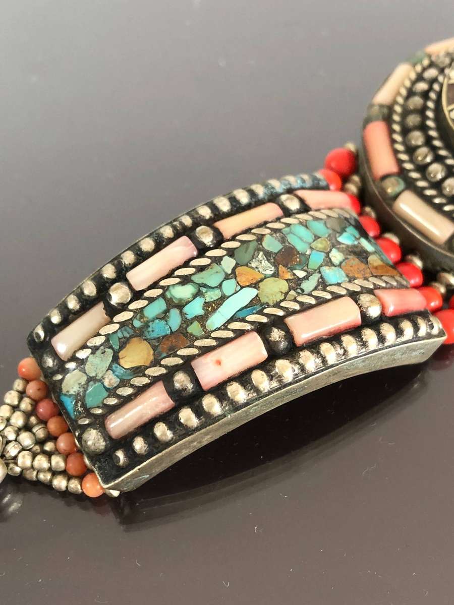 A Tibetan Silver Bracelet with intricate Turquoise and Red Coral Inlay
