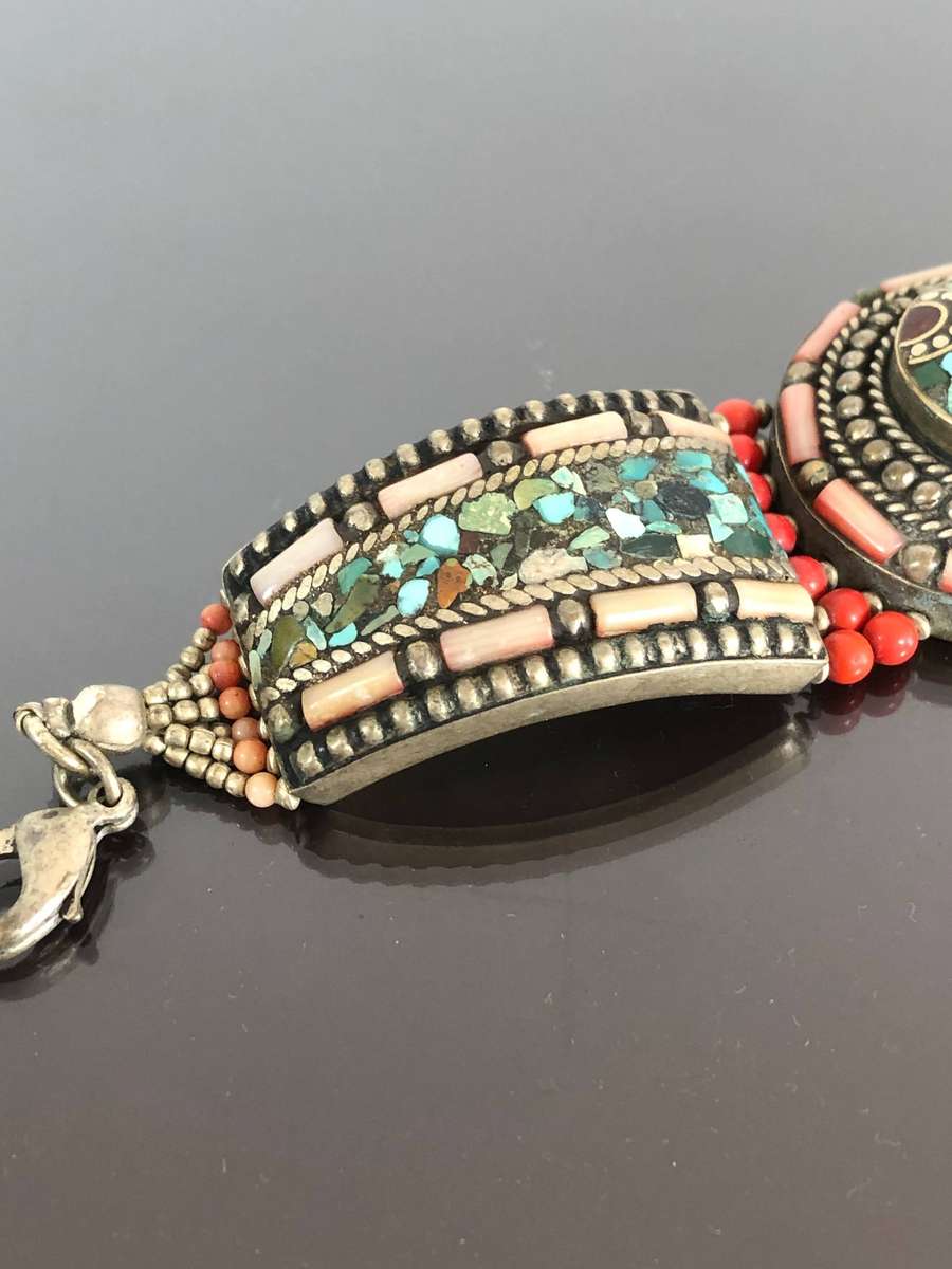 A Tibetan Silver Bracelet with intricate Turquoise and Red Coral Inlay