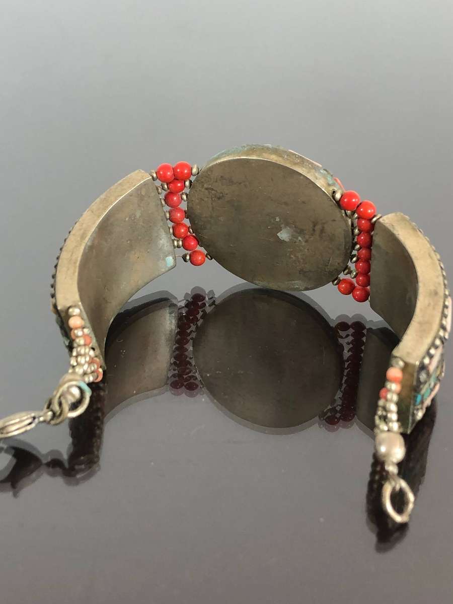 A Tibetan Silver Bracelet with intricate Turquoise and Red Coral Inlay