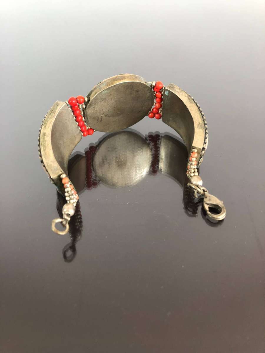 A Tibetan Silver Bracelet with intricate Turquoise and Red Coral Inlay