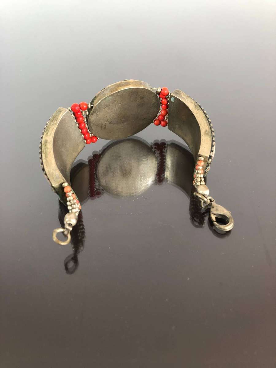 A Tibetan Silver Bracelet with intricate Turquoise and Red Coral Inlay