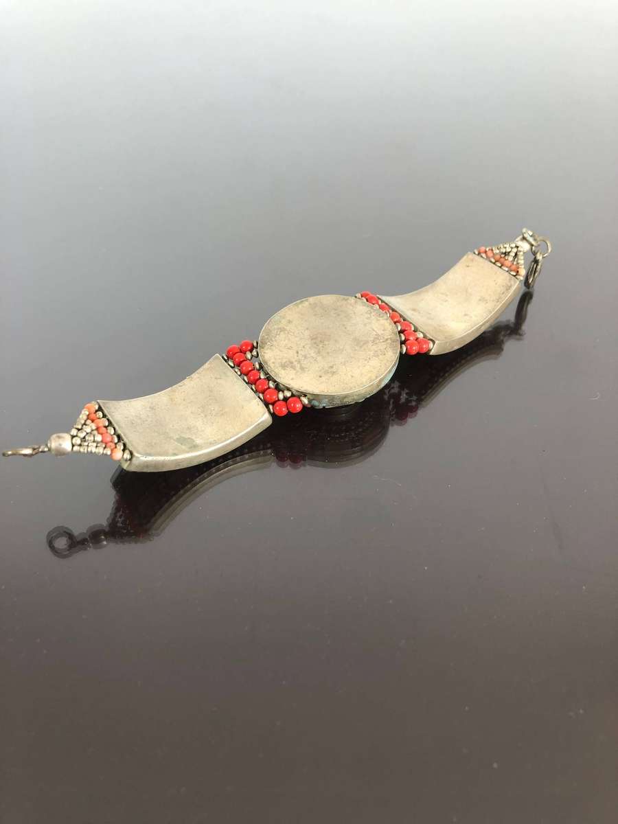A Tibetan Silver Bracelet with intricate Turquoise and Red Coral Inlay