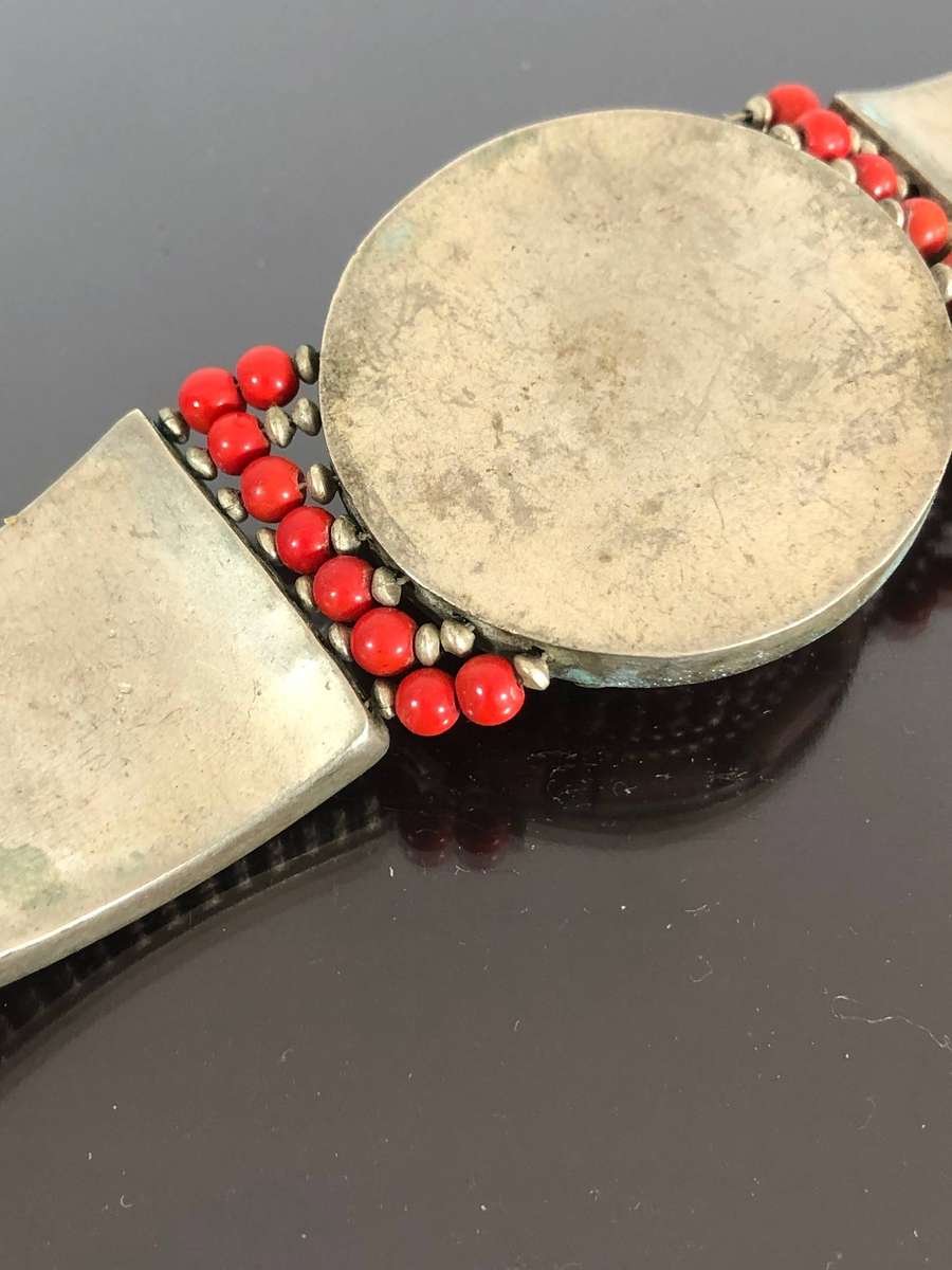 A Tibetan Silver Bracelet with intricate Turquoise and Red Coral Inlay