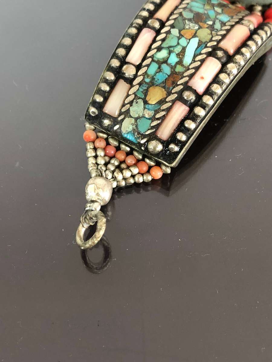 A Tibetan Silver Bracelet with intricate Turquoise and Red Coral Inlay