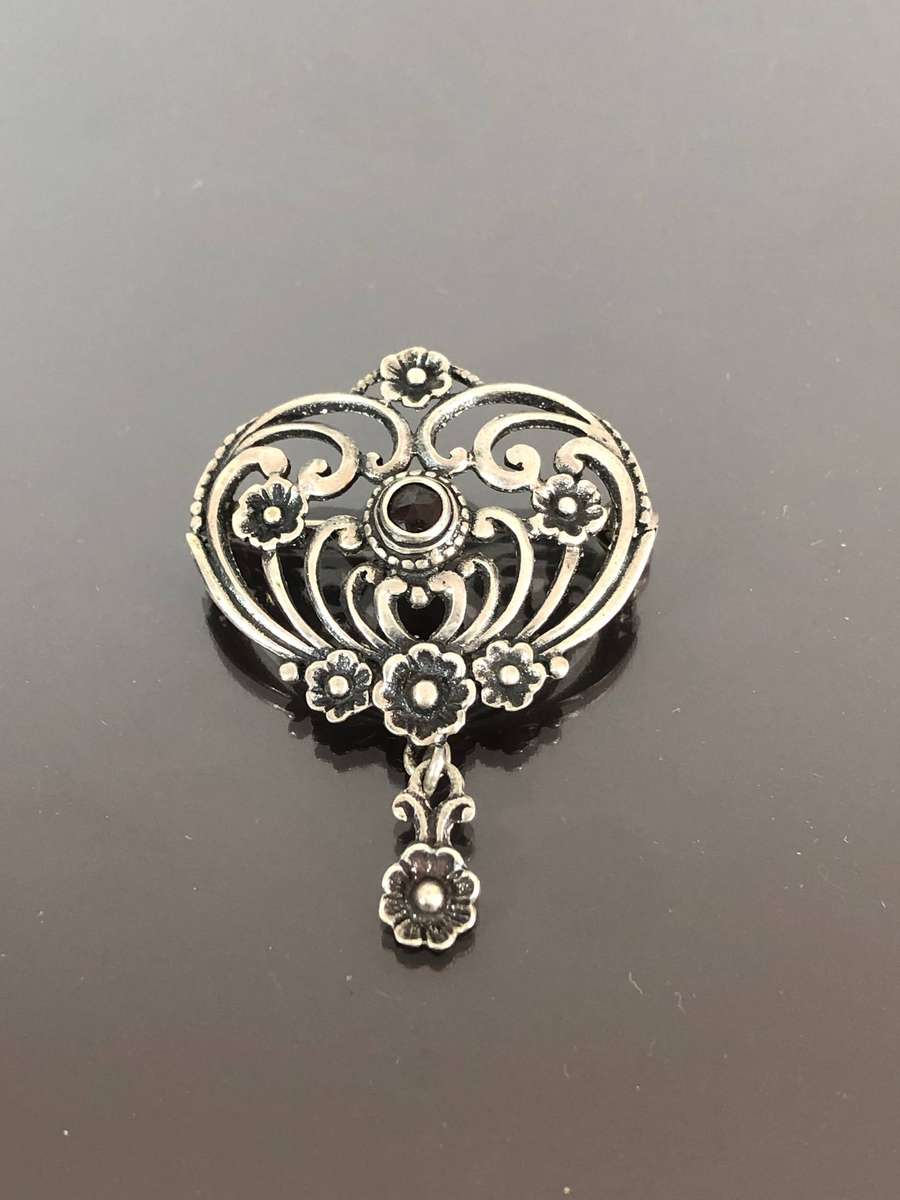 A Victorian Period Silver Pin Brooch with Possible Garnet