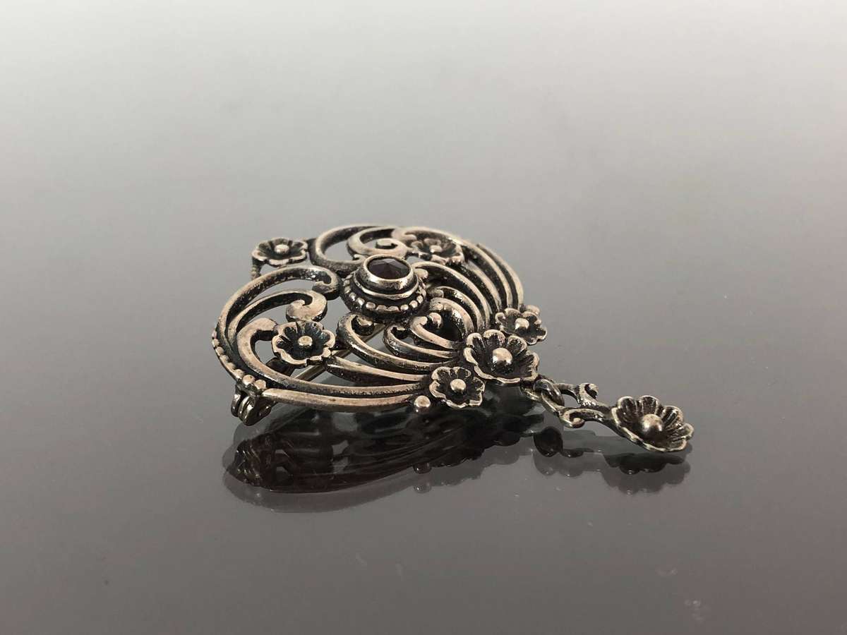 A Victorian Period Silver Pin Brooch with Possible Garnet