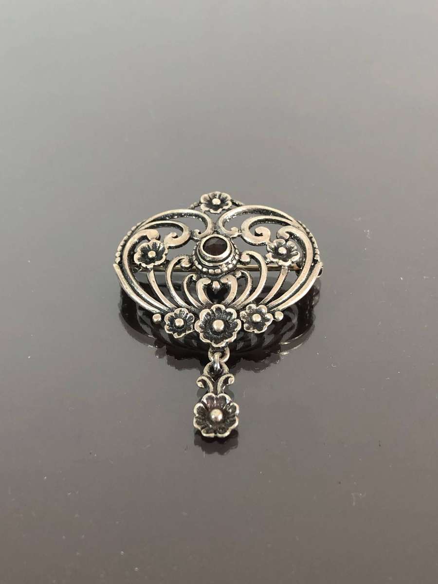 A Victorian Period Silver Pin Brooch with Possible Garnet