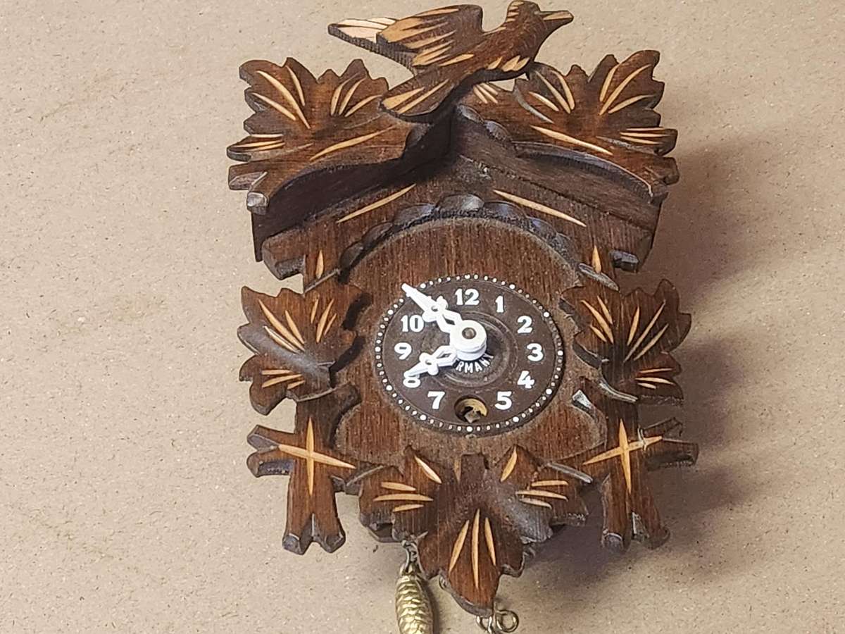 J ENGSTLER MINIATURE CUCKOO CLOCK IN WORKING CONDITION