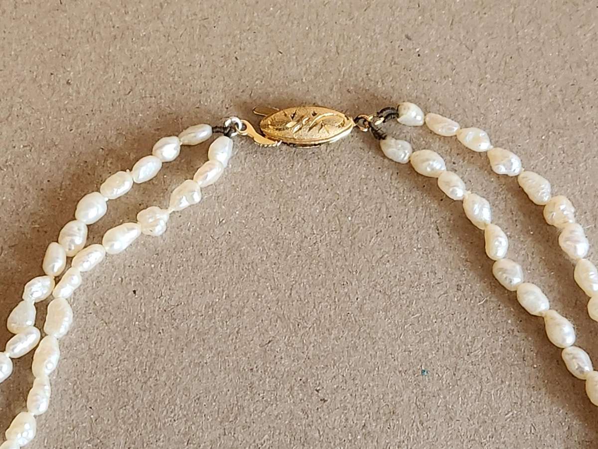 TWIN STRAND CULTURED PEARLS WITH A SILVER CLASP
