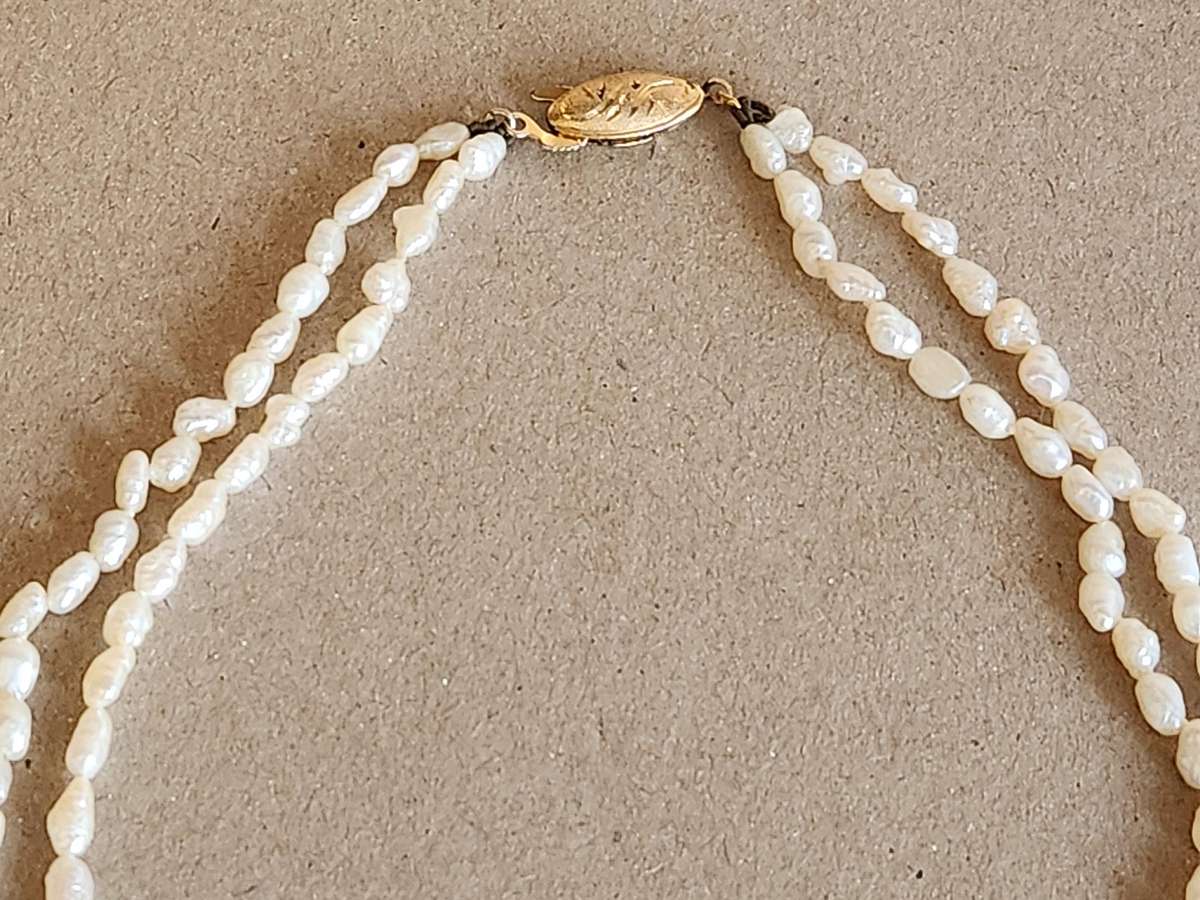 TWIN STRAND CULTURED PEARLS WITH A SILVER CLASP