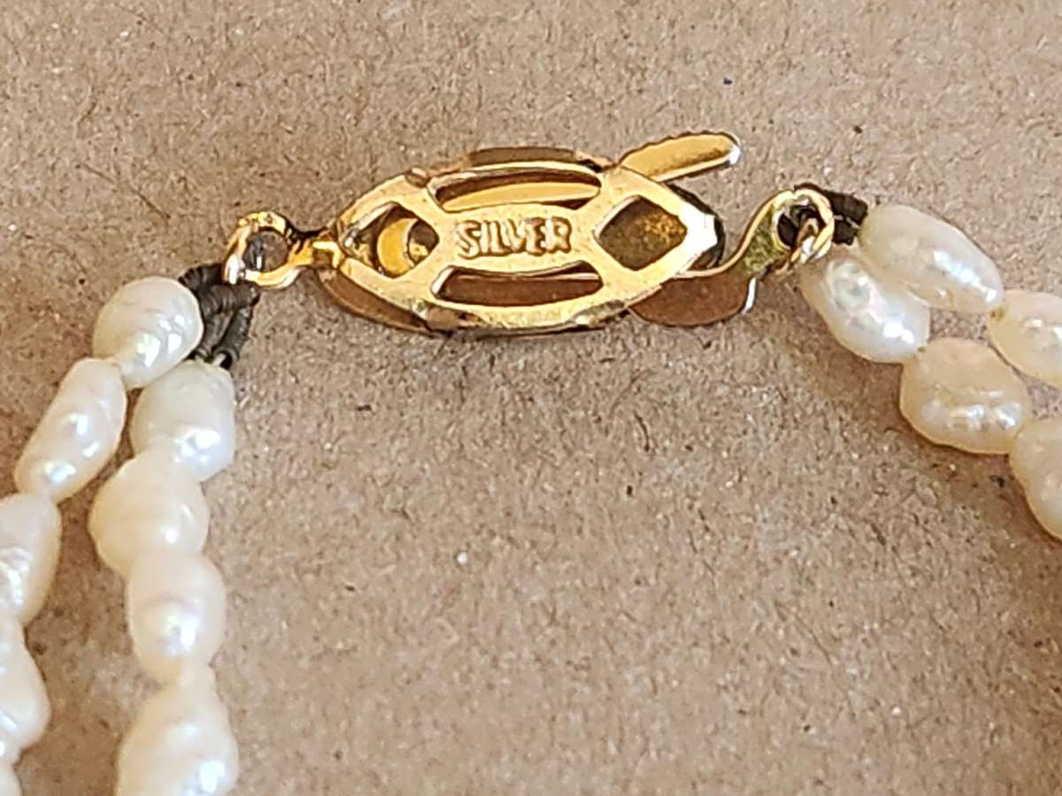 TWIN STRAND CULTURED PEARLS WITH A SILVER CLASP