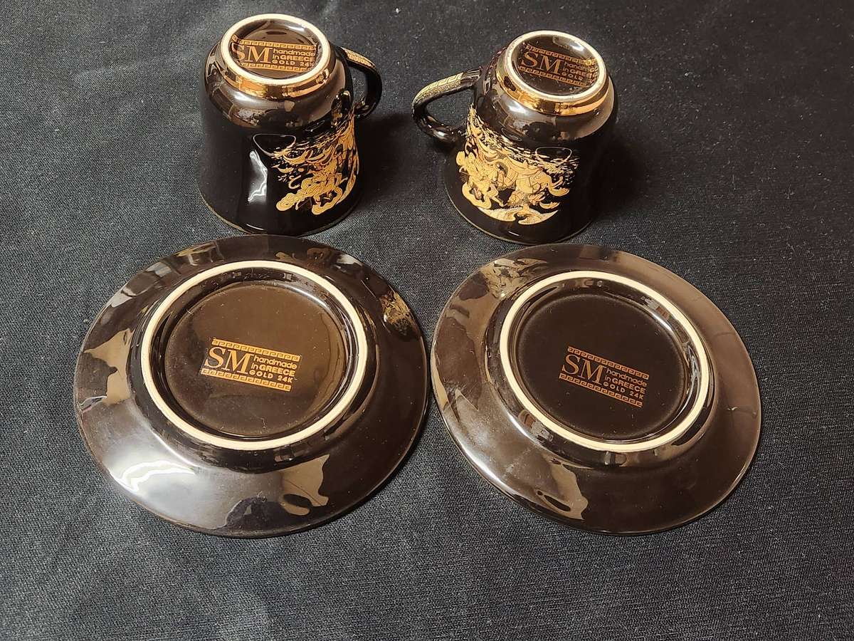 PAIR OF FOUR HANDMADE IN GREECE DEMITASSE CUPS AND SAUCERS WITH A 24 K GOLD FINISHING
