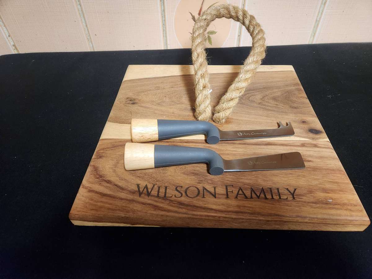 ANDY CARTWRIGHT CHEESE KNIFE SET ON A WOODEN BOARD